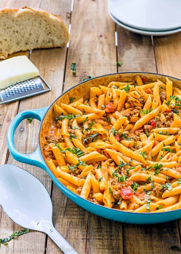 big skillet with Penne with Sausage and Spicy Cream Tomato Sauce 