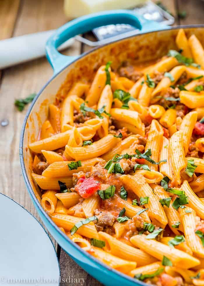 Big skillet with Penne with Sausage and Spicy Cream Tomato Sauce 