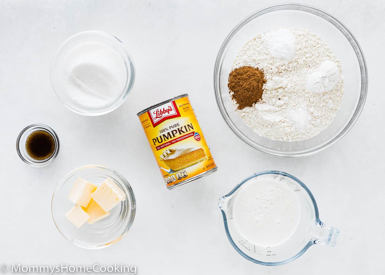 ingredients needed to make eggless pumpkin waffles over a white surface with tag names.