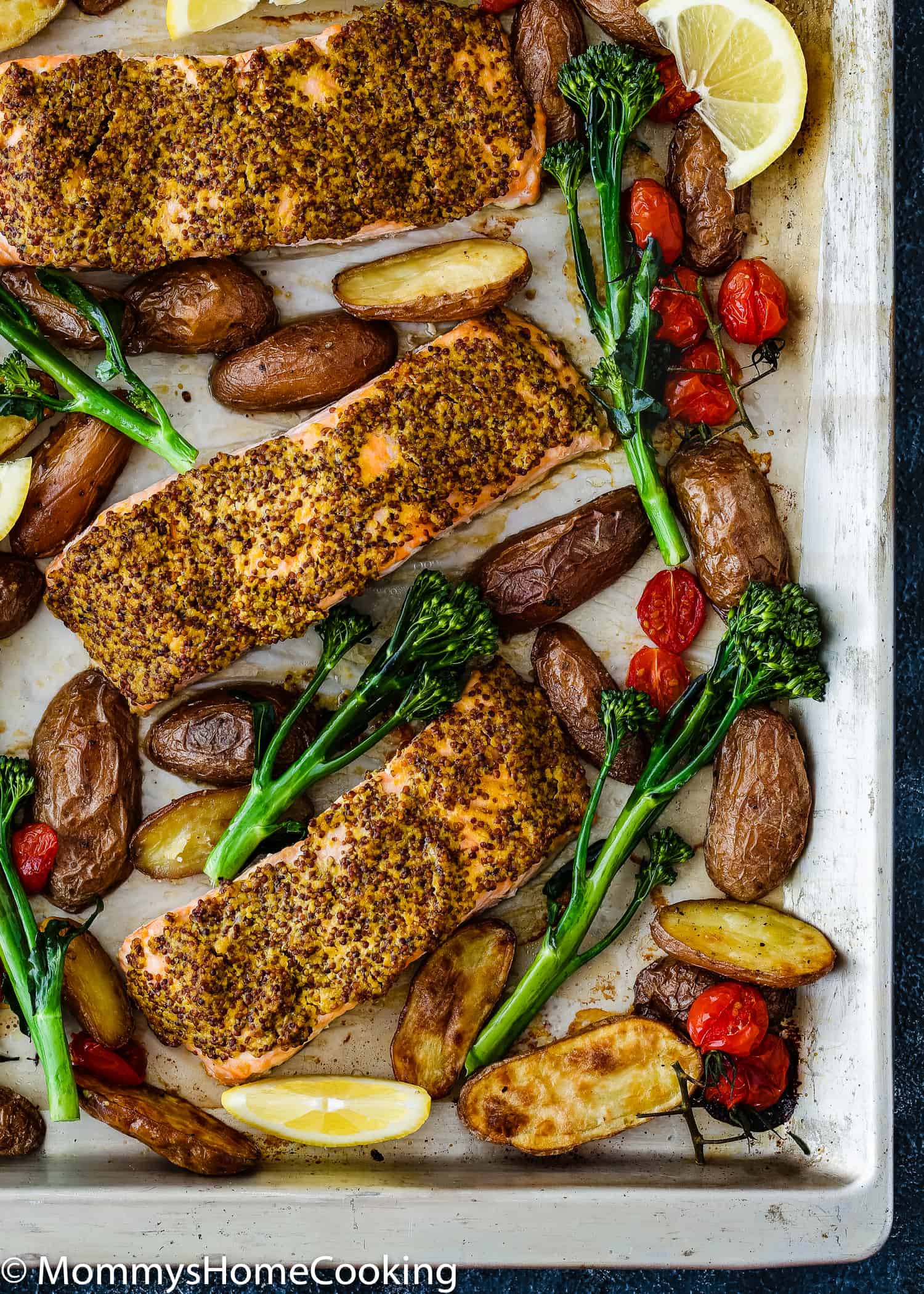 Sheet Pan with Salmon Filets, roasted potatoes, tomatoes.