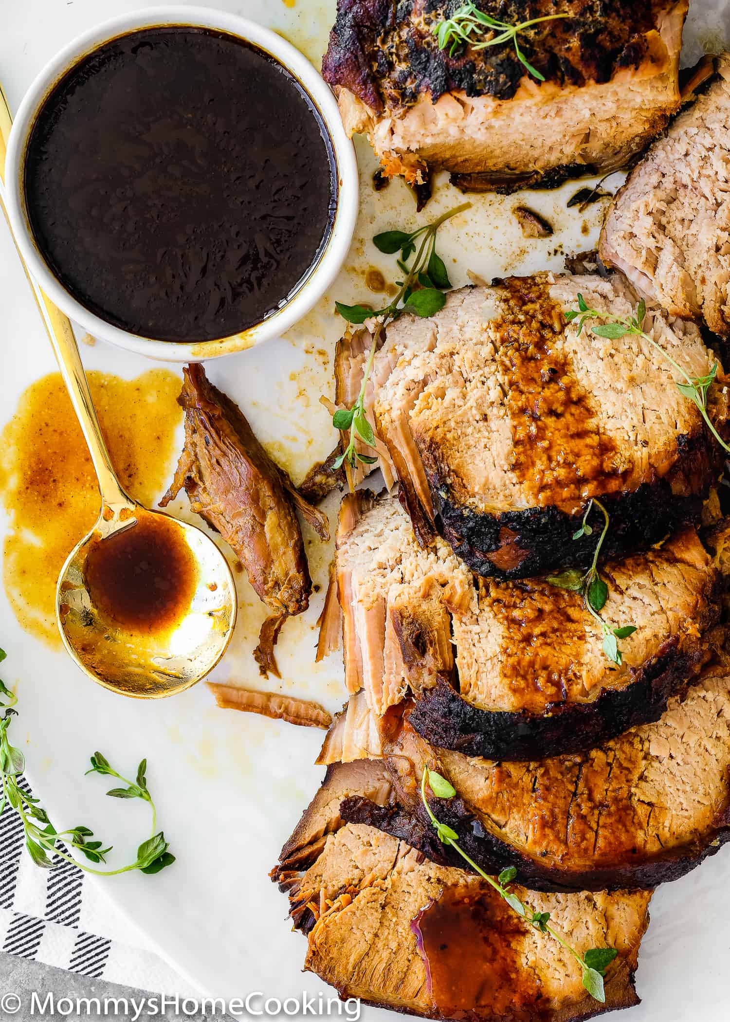 This Slow Cooker Honey Balsamic Pork Loin is tender, juicy and fall-apart delicious! Smothered in a rich honey balsamic sauce, this pork loin is easy for weeknight dinner yet fancy, elegant and impressive enough for company. https://mommyshomecooking.com