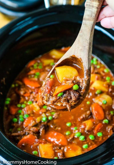 a serving spoon with Slow Cooker Oxtail Stew
