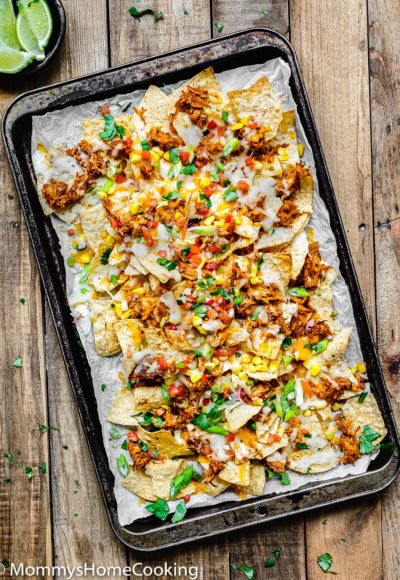 overhead view of Tequila Barbecue Chicken nachos on a baking sheet