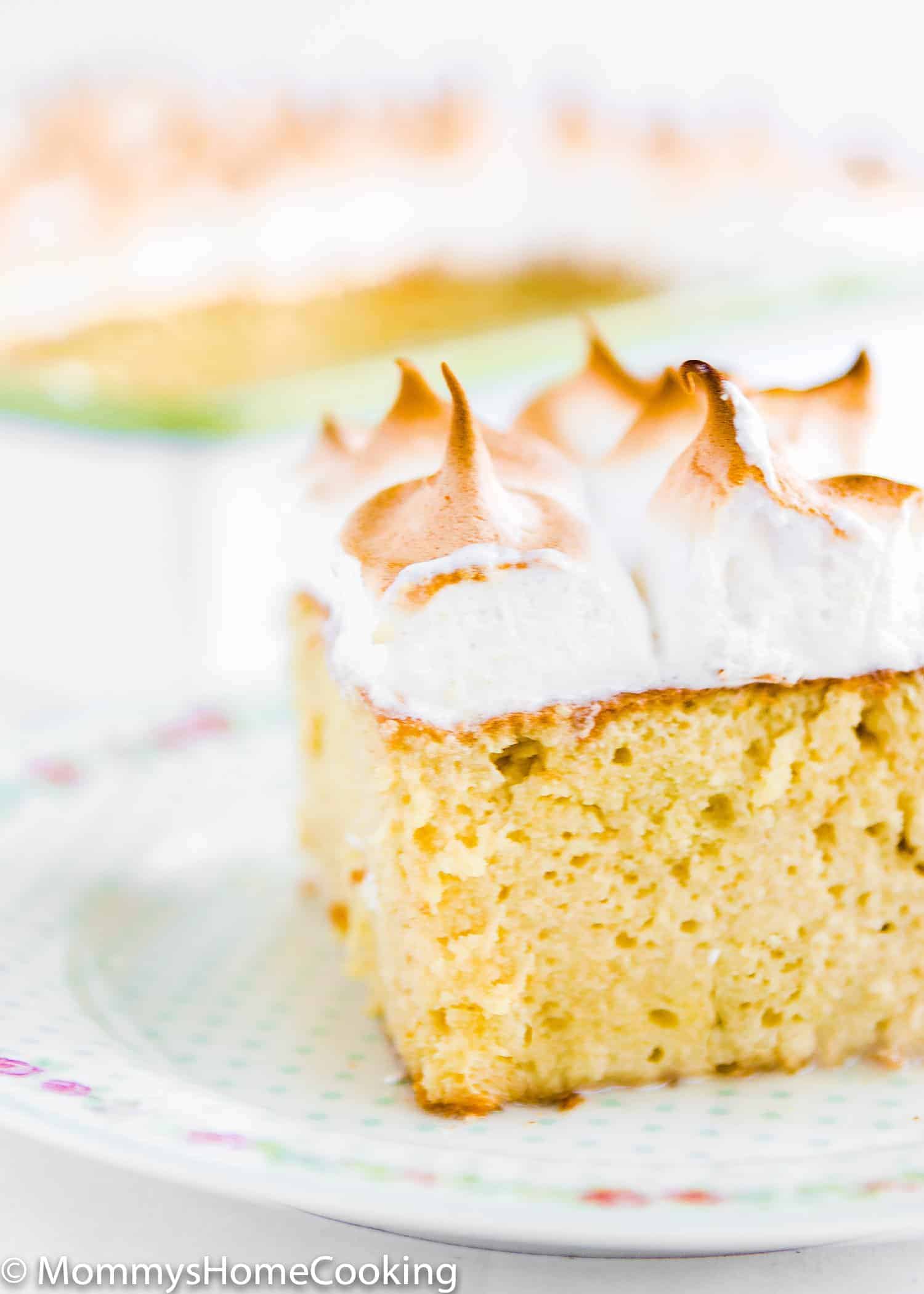 This Tres Leches Cake is amazingly delicious! An ultra luscious cake soaked in a sweet milk mixture and topped with Italian meringue. https://mommyshomecooking.com