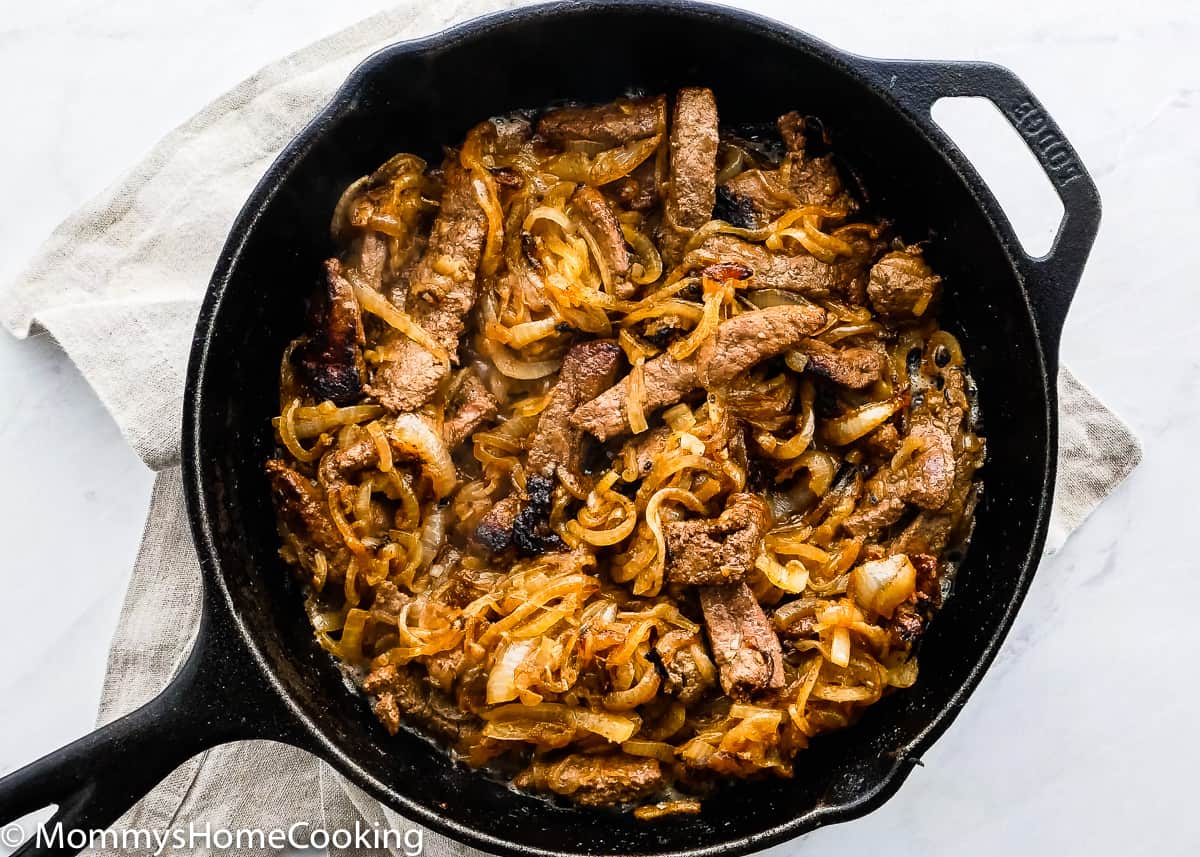 cooked onions and beef liver in a cash iron skillet.